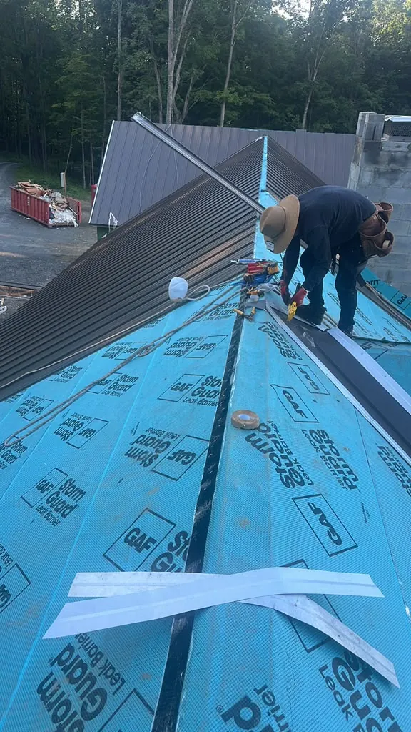Installing standing-seam metal roof panels