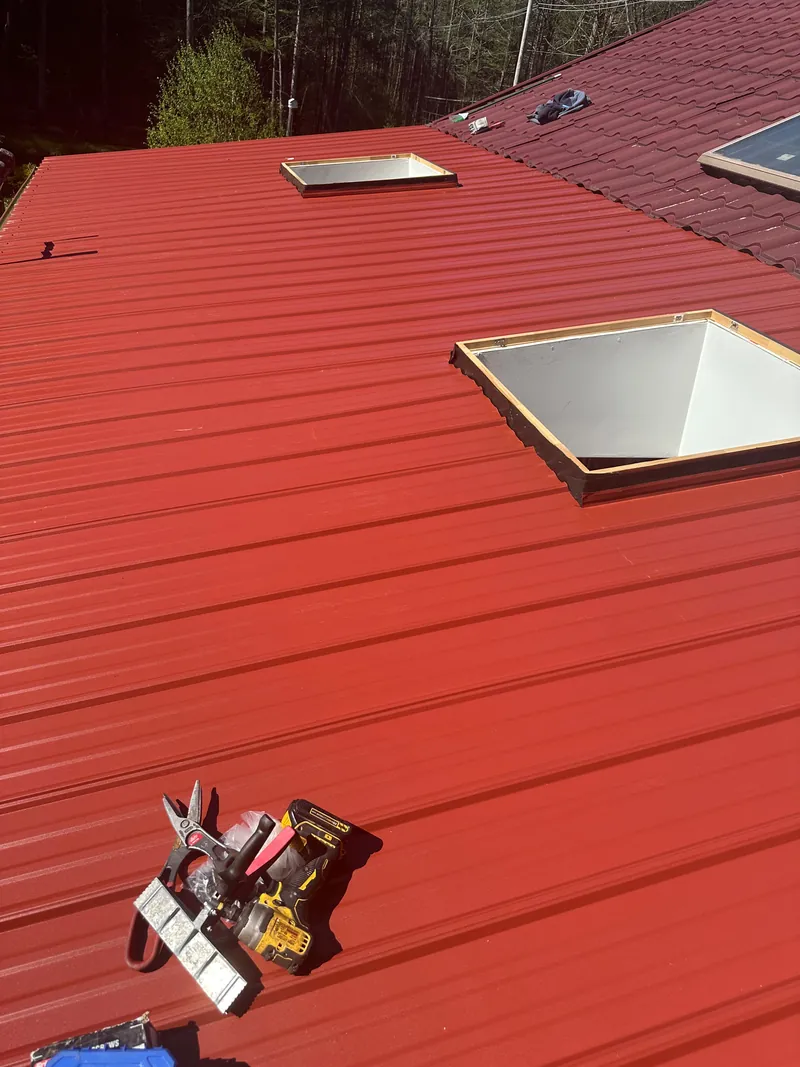 Finished red metal roof with skylights