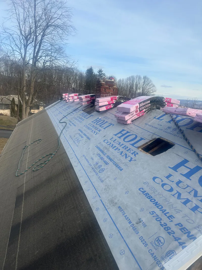 Synthetic underlayment with shingles staged