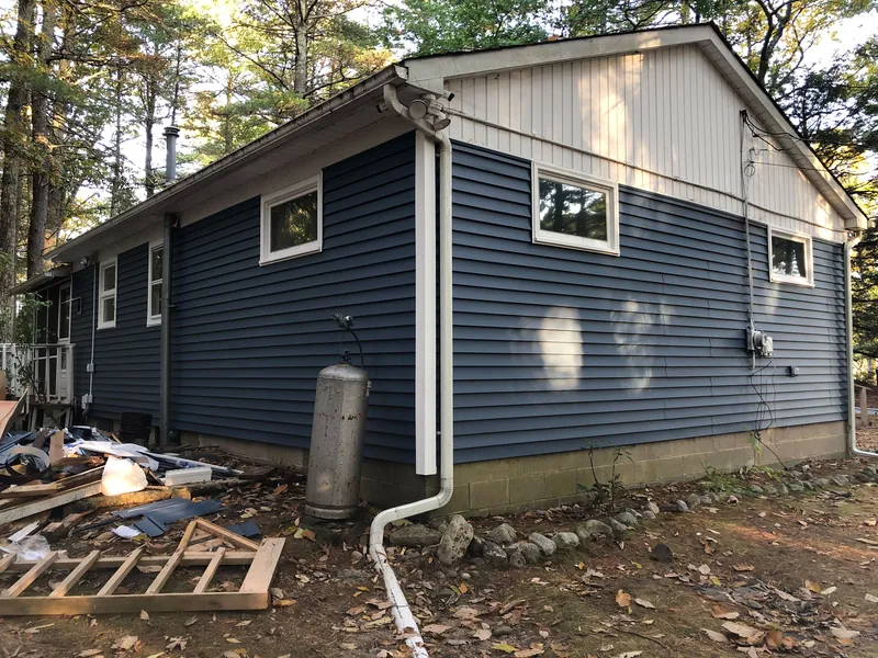 New blue vinyl siding and trim
